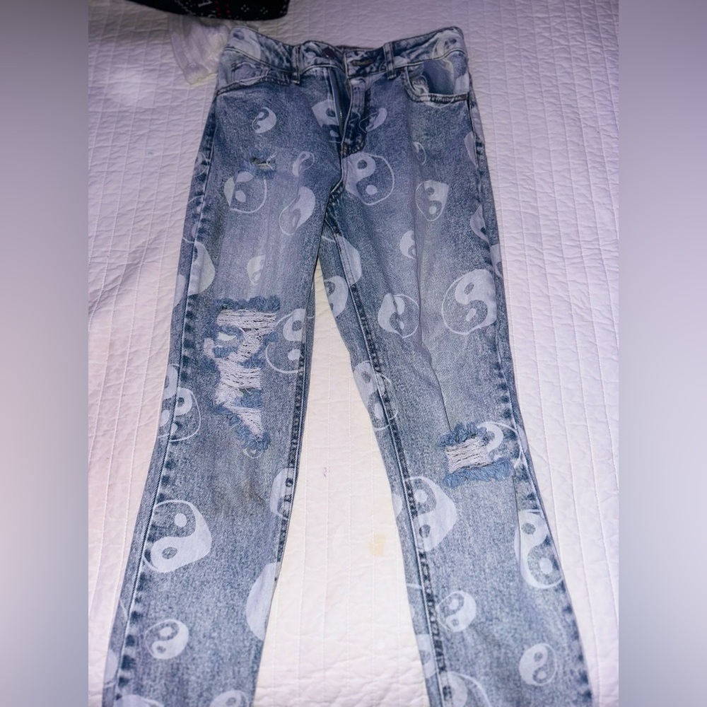 Women’s jeans ripped with design on them